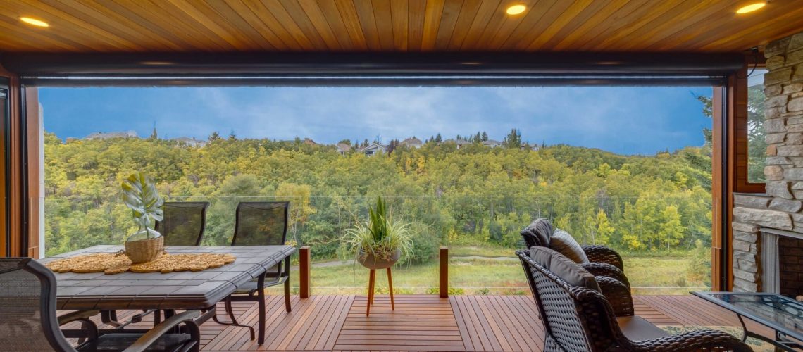 full cover outdoor living space with lighting in a wood cieling and ornate wooden patio